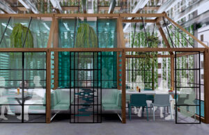 A rendering of ILLUME's private, separated dining spaces, surrounded by vertical produce gardens