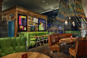 Vibrantly colored seating and beaded embellishments add to the ambience at Nando's Bay Street in Toronto, Canada