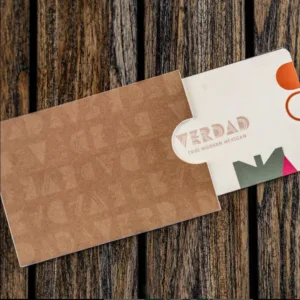 A Verdad gift card in a branded paper sleeve